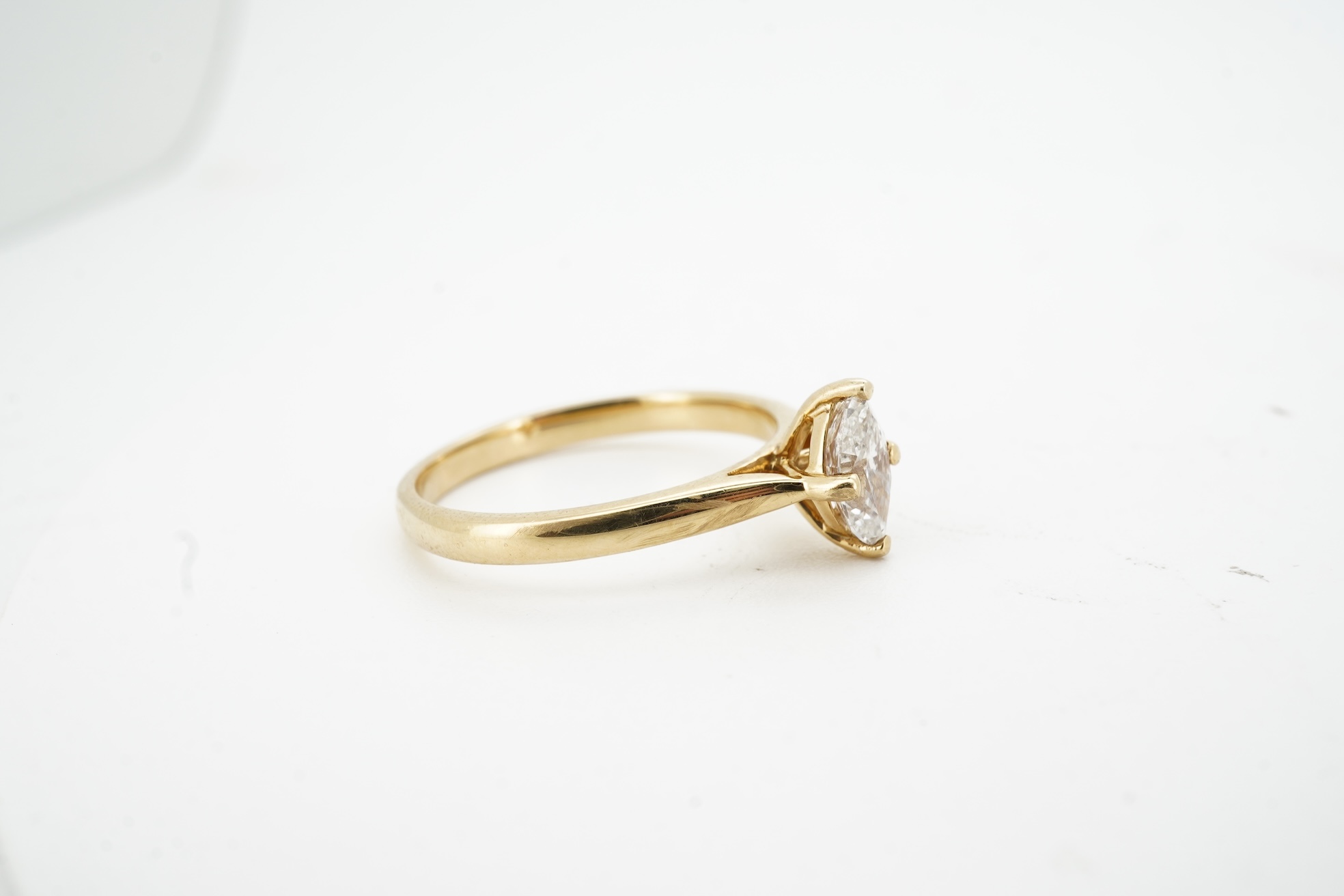 A diamond ring, claw-set with a marquise-shaped diamond weighing approximately 0.70 carats, mounted in gold, size L1/2, gross weight approximately 3 grams